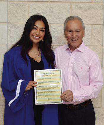 Amore Zapata, left, and Phil King pose with the scholarship. COURTESY PHOTO | KENNETH PEISER