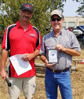 Scott Carrigan, left, presented Storm’s Drive-In owner Mike Green a plaque on Sept. 11 to thank him for 15 years of hosting the Classics at the Classic events. COURTESY PHOTO