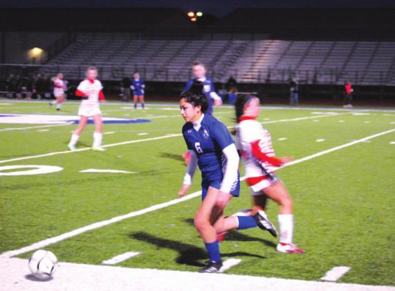 Kailyn Cisneros dribbles past a Salado Lady Eagle player in last week’s contest. HUNTER KING | DISPATCH RECORD