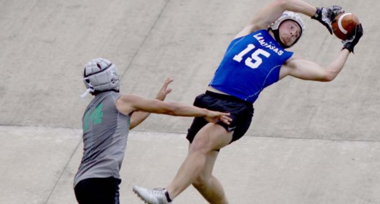 Case Brister goes up to catch a pass during 7-on-7 competition over the summer. FILE PHOTO