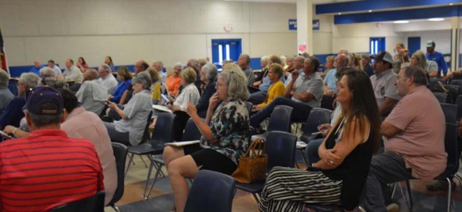 More than 80 parents and residents listened to a solar farm presentation inside the middle school cafeteria Wednesday evening. All who spoke during the open forum session were opposed to the proposal. MONIQUE BRAND | DISPATCH RECORD