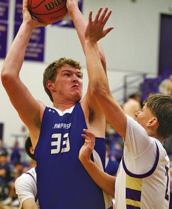 Beau Patterson towers over a Marble Falls defender during his senior year at Lampasas. FILE PHOTO
