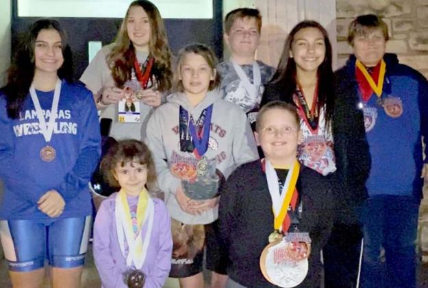 Wrestlers pictured include, front row, left to right, Aviendha and Liam Smith; middle row, Kaitlynn Jones, Taylor Martell, and Charlie Freese; back row: Mia Martell, Jayce West and Tristan Jones. Not pictured: Megan Carver, Emma Phillips, Brianna Miller, Jacob Miller, Sean Miller and Lola Miller. COURTESY PHOTO