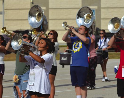 The Lampasas Badger Band practices its new fall marching show, “Rio – City of Rhythm,” after school on Tuesday. The band will debut some of its performance at tonight’s football game in Gatesville. ERICK MITCHELL | DISPATCH RECORD