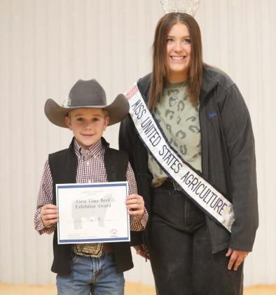 Trigg Hill is following in the footsteps of his older brothers in showing cattle. The Colorado River Cattlewomen and Miss United States Agriculture presented him a certificate as a beef exhibitor. COURTESY PHOTO