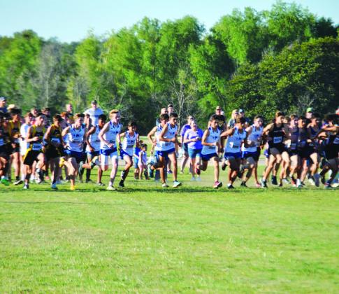 The boys’ cross country team takes off from the start line at the home meet last week. HUNTER KING | DISPATCH RECORD