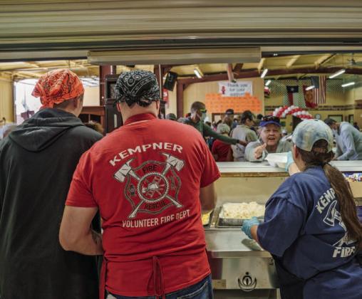 Kempner VFD volunteers Collin Martin, Steven Martin and Norine Martin are pictured left to right serving guests at the Kempner VFD BBQ and Auction in the spring of 2023. FILE PHOTO