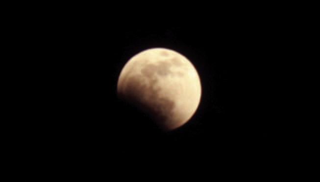 The partial eclipse of the moon should be visible across North America late Thursday night, with its peak to take place around 11:30 p.m. FILE PHOTO
