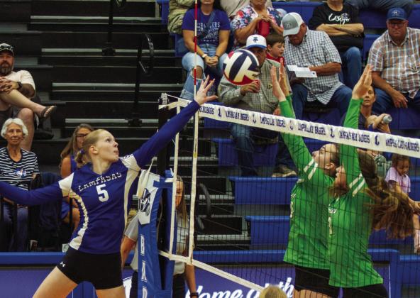 Lampasas junior outside hitter Mattie McBeth tips the volleyball over the net for a kill. PHOTO BY ANA SOFIA MEYER | DISPATCH RECORD