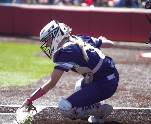 HUNTER KING | DISPATCH RECORD Kali Hunter digs out a low pitch during the first game of the bi-district series against Salado last Saturday.