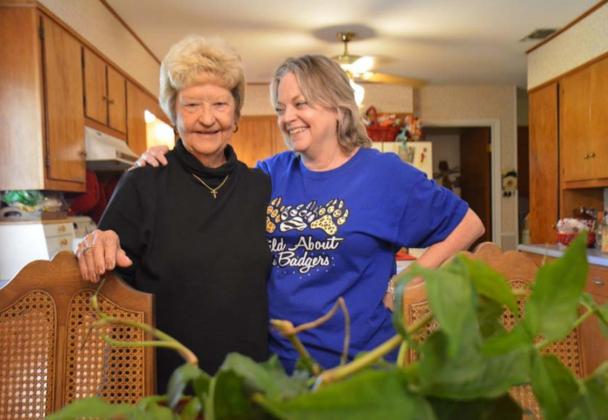 Treva Clark and daughter, Melanie Brooks, share family stories with the ivy plant that has been in the family for decades. MONIQUE BRAND | DISPATCH RECORD