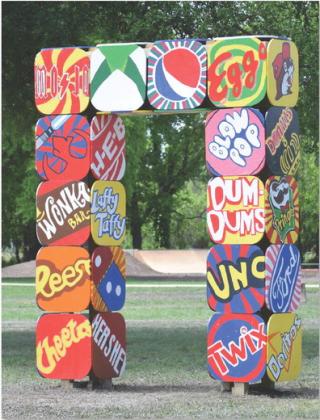 The Pop Art Portal, designed and created by Mike Kuehne’s sixth-grade art classes, stands tall in the Hanna Springs Sculpture Garden. See related photo on page 10. ALEXANDRIA RANDOLPH | DISPATCH RECORD