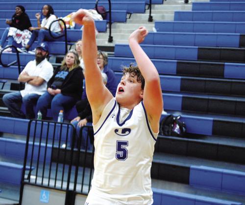 Aidan Nuckles lets fly one of his five successful threes in Tuesday’s game against Eastside Memorial. HUNTER KING | DISPATCH RECORD