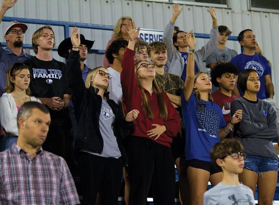 Students praise the Lord and sing along to worship music to close out the Fields of Faith celebration. The event takes place annually in October at Badger Stadium. hunter king | Ldispatch record