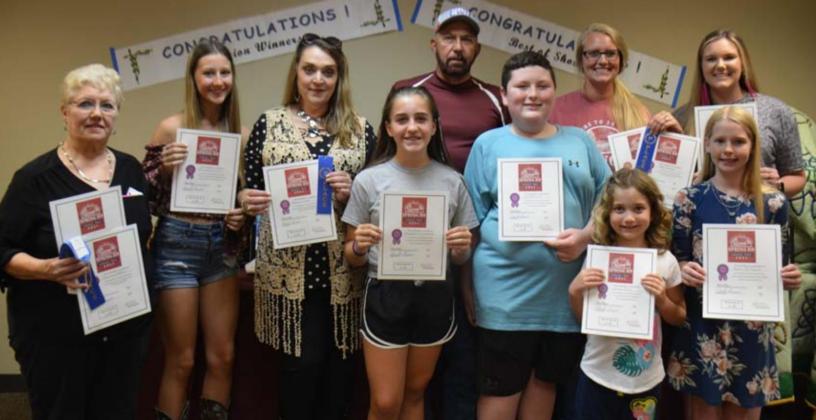 Division champions named at the County Fair include, back row from left, Bonnie Wales, Brandy Tower, Delores Tower, Gary Franklin, Katy Darden and Megan Caddies; and front row, Payton Crawford, Grant Gill, Anna Gray and Mattie McBeth. MONIQUE BRAND | DISPATCH RECORD
