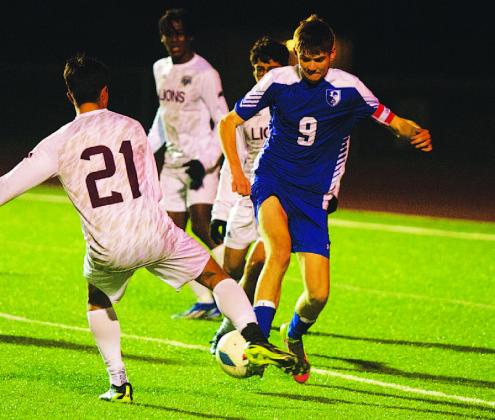 HUNTER KING | DISPATCH RECORD Keaton Black fights for possession of the ball against Brownwood in the Badgers’ district opener.
