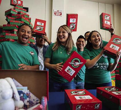 Volunteers such as these pack shoebox gifts to be sent to children around the world. Operation Christmas Child is a ministry of Samaritan’s Purse. National Collection Week for the shoeboxes will be Nov. 16-23. COURTESY PHOTO | SAMARITAN’S PURSE