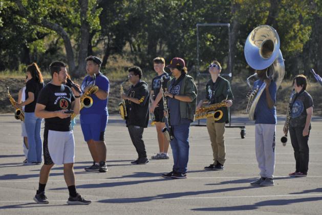 Lampasas High School band director Eduardo Zambrano leads the Badger Band through marching practice earlier this fall. Nineteen LHS band students earned All-Region honors. ERICK MITCHELL | DISPATCH RECORD