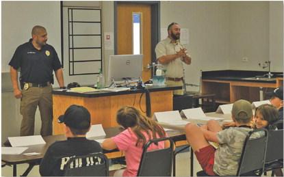 Students listen to officers from the Lampasas Police Department during Tuesday’s Jr. Police Academy session at the Lampasas County Higher Education Center. ERICK MITCHELL | DISPATCH RECORD