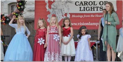 The youngest division of Snow Queen Pageant contestants give the audience one last look before walking off stage during last Saturday’s festivities. ERICK MITCHELL | DISPATCH RECORD