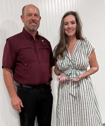 COURTESY PHOTO Superintendent Rob Moore congratulates UIL Sponsor Excellence Award recipient Cheri Jay-Wienecke. She has served as a UIL speech and debate coach for the Lometa ISD for many years, helping her students win numerous state championships and garner countless awards at the district and regional level.