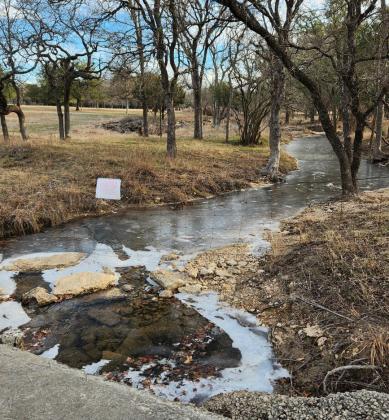Some snow and icy patches remain visible in shaded areas, as the temperature didn’t rise above freezing in Lampasas until mid-morning Wednesday. This wet-weather creek along South Willis Street still bears signs of the frosty precipitation that fell across the county on Monday. ALLYSSE LOWE | COURTESY PHOTO