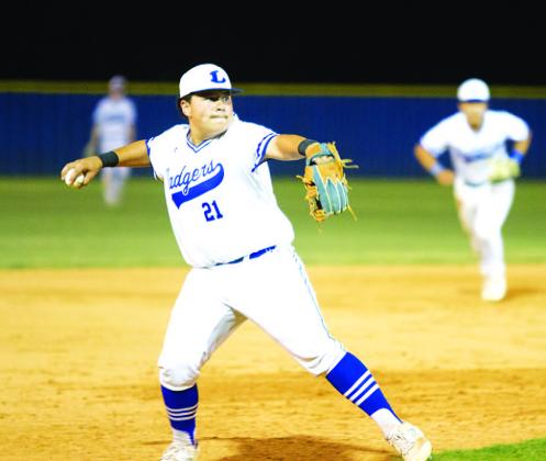 Benny Rodriguez throws home to get a Lago Vista runner out late in Tuesday’s game. HUNTER KING | DISPATCH RECORD