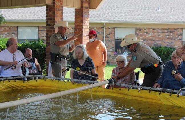 Nursing home holds early Father’s Day celebration with fishing event