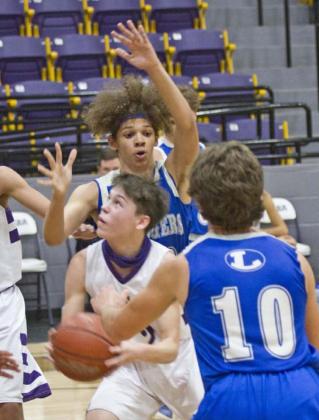 Cameron Stokes (back-center) and Aden Rascoe (10) defend in the Badger JV game at San Saba. JEFF LOWE | DISPATCH RECORD