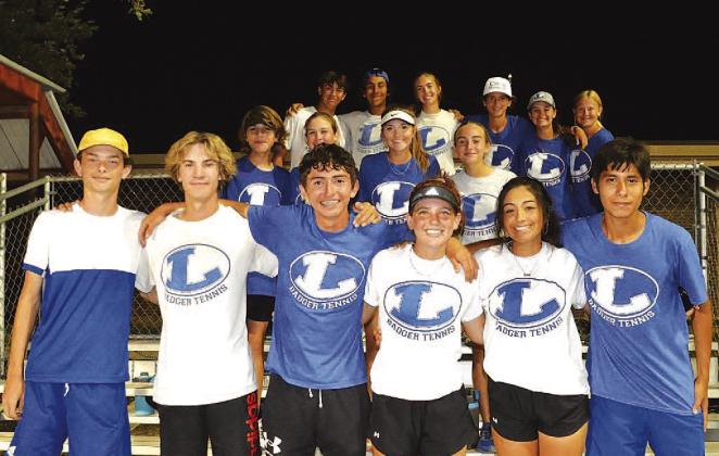 The tennis team poses for a photo after their dramatic victory last Friday night. COURTESY PHOTO