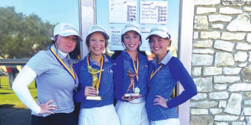 Jennifer Greiner, left, Kenlee Turner, Kylee Rutledge and Shaylee Wolfe pose for a photo with their trophy after winning in Marble Falls. COURTESY PHOTO