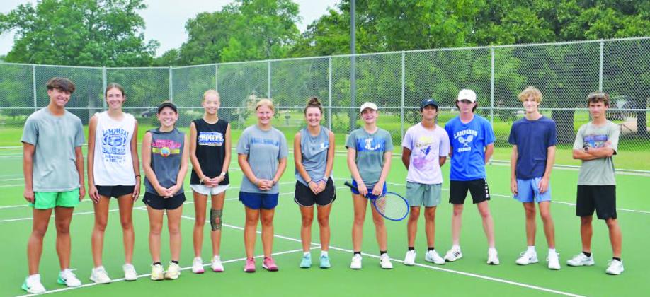 COURTESY PHOTO | KENNETH PEISER All 11 tennis players who made the trip to the regional tournament pose for a photo while in Bryan.