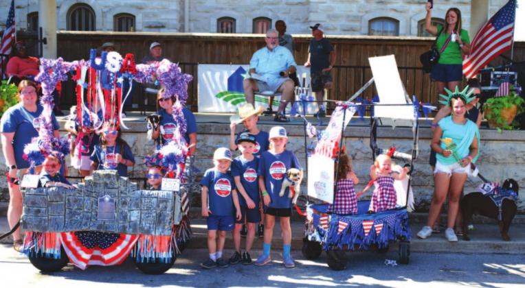 Theme winners for the Pet Parade were announced: first place, Marlee, Chett and Ky with Dixie, Harvey and June; second, a float titled “Let Cousins Spring”; and third, Brodie with dog Avery. They are pictured here left to right. MASON HINES | DISPATCH RECORD