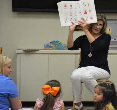 Beta Mu member and retired educator Jan Vann reads books about animals to a young audience at the Lampasas Public Library during last year’s Summer Reading Program. file photo