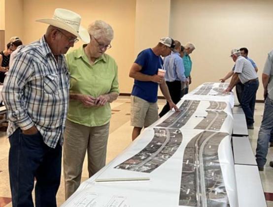 Landowners view a map of the U.S. 183 widening project that was displayed at last week’s event in Lometa. MASON HINES | DISPATCH RECORD