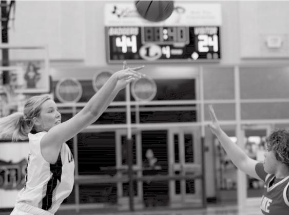 Laurcy Bender shoots a three-pointer in a home game Tuesday against Lake Belton. JEFF LOWE | DISPATCH RECORD
