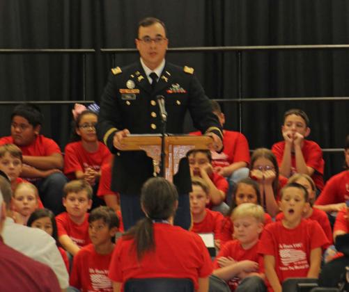 Capt. Eric Paul addresses the students, faculty and guests present at the “Salute to America’s Soldiers” program offered by Taylor Creek Elementary School fourth-graders. Joycesarah McCabe | Dispatch Record