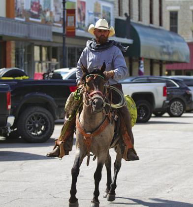 Jeremy Robinson rides his horse Trooper through downtown Lampasas on Wednesday. Robinson is nearing the end of a trek across Texas to raise awareness about veteran homelessness. His ultimate goal is to build a homestead and equine center where veterans could stay as long as needed, grow their own food and experience the “brotherhood” with others they experienced while in the military. HUNTER KING | DISPATCH RECORD
