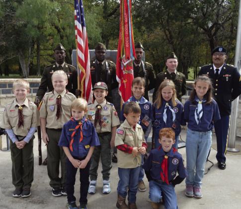 ERICK MITCHELL | DISPATCH RECORD Cub Scout Pack 100 led the audience in reciting the pledge of allegiance, while the 62nd Engineer Battalion -- the city of Kempner’s partner battalion from Fort Cavazos -- presented the colors to open the Nov. 11 Veterans Day ceremony at Sylvia Tucker Memorial Park.