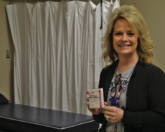 LISD Director of School Health Services Donna Clark holds the Narcan medication that now is available for emergency use. ERICK MITCHELL | DISPATCH RECORD