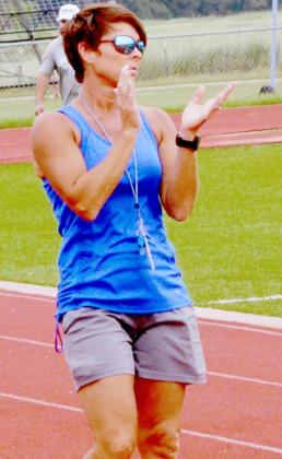 Christy Wiley cheers on athletes during Speed, Weights and Agility Training on Wednesday. JEFF LOWE | DISPATCH RECORD