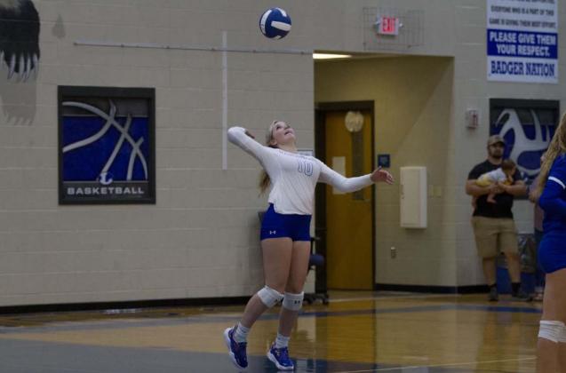 Laurcy Bender goes up for a serve during the Lady Badgers’ match last week against Glen Rose. HUNTER KING | DISPATCH RECORD