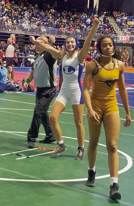 Freese throws her hands up after winning a match at state. COURTESY PHOTO | LHS WRESTLING TWITTER