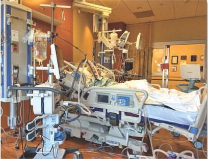 Local realtor Ron Kuker lies in a Houston hospital bed in the Intensive Care Unit before receiving a heart transplant. DEBBIE KUKER | COURTESY PHOTO
