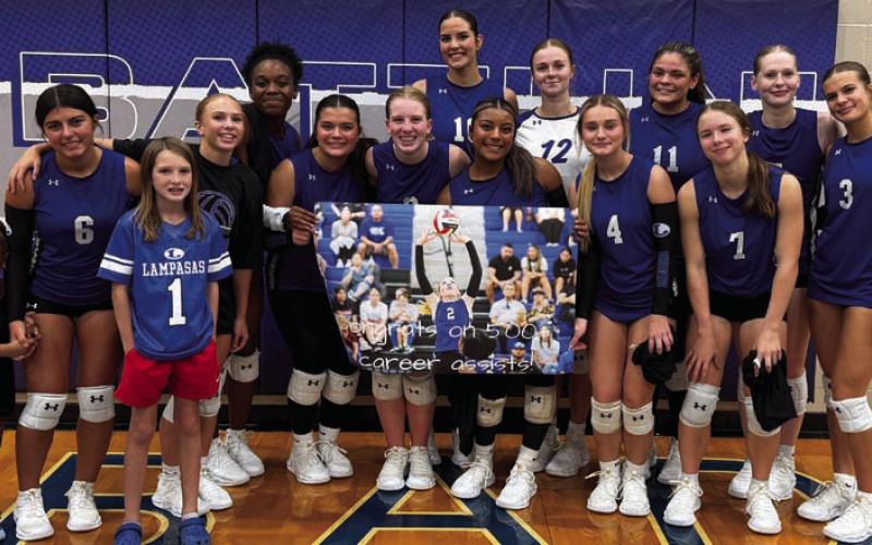 After Tuesady,’s match, the Lady Badger volleyball team celebrated junior Ellie Felkner’s recent milestone of 500 career assists. ERICK MITCHELL | DISPATCH RECORD