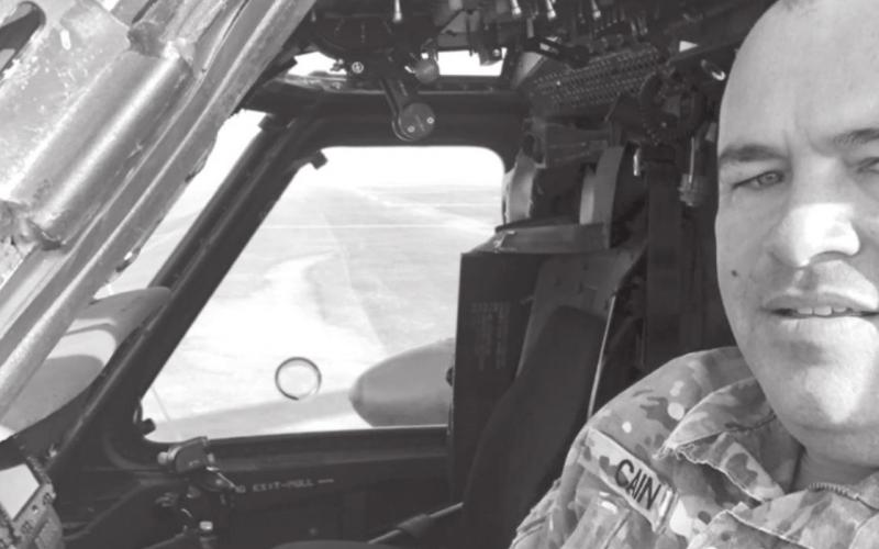 Chief Warrant Officer 2 Allen Cain sits inside a Blackhawk helicopter on deployment to Saudia Arabia. COURTESY PHOTO