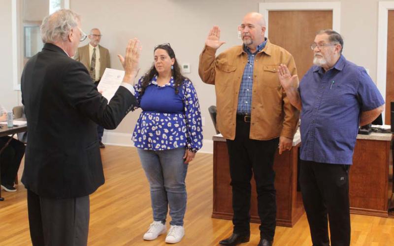 At the May 13 Lampasas City Council meeting, Municipal Court Judge Robert Gradel administered the oath of office to re-elected members Catherine Kuehne, Davis Keele and Chuck Williamson, pictured left to right. courtesy photo | City of Lampasas