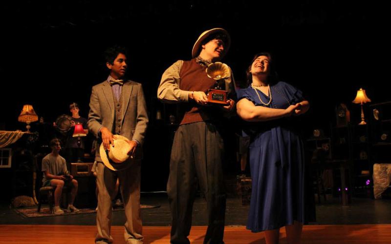 In 2023, the Lampasas High School theater company put on “Failure: A Love Story.” James Vasquez, at left, playing the part of Mortimer Mortimer, is pictured with Luke Coonrod, playing the part of John N. Fail, and Ciara Carnes, playing the part of Nelly Fail, as they rehearse a scene in which Nelly is singing to the music of the gramophone and Mortimer gazes on, thinking Nelly is the most beautiful woman he’s ever seen. file photo