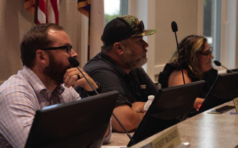 Planning and Zoning Commission members, from left, Zach Carnley, Zachary Taylor and Marisa Canales listen to public input on a proposal to build duplexes along Naruna Road at Sheppard Lane. ERICK MITCHELL | DISPATCH RECORD