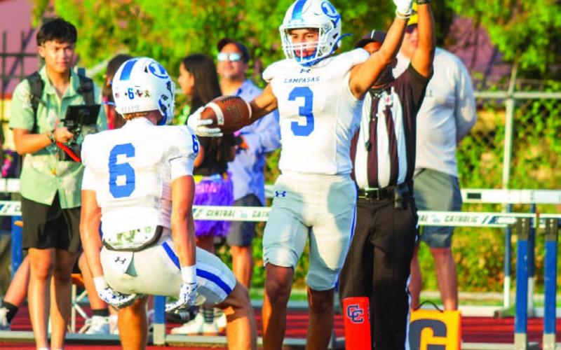 Tripp Stinnett celebrates his touchdown with Brayden McLoughlin. ANA SOFIA MEYER | DISPATCH RECORD